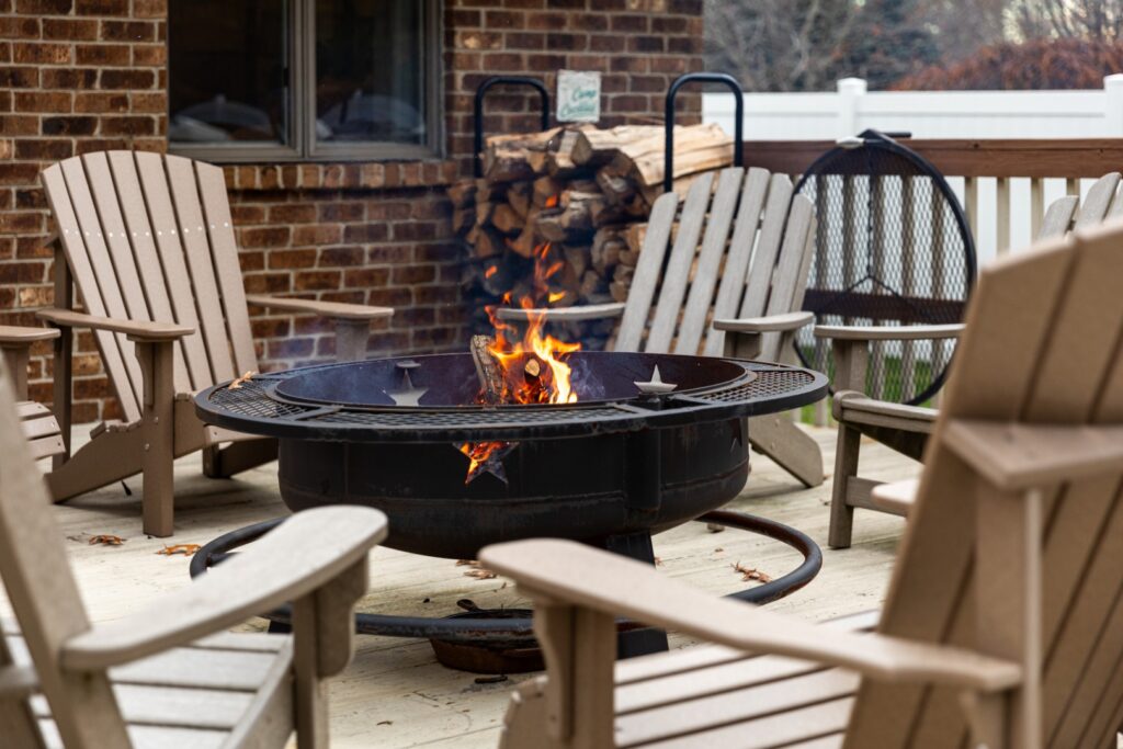 Outdoor fire pit with wooden chairs