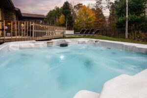 Outdoor hot tub by wooden deck