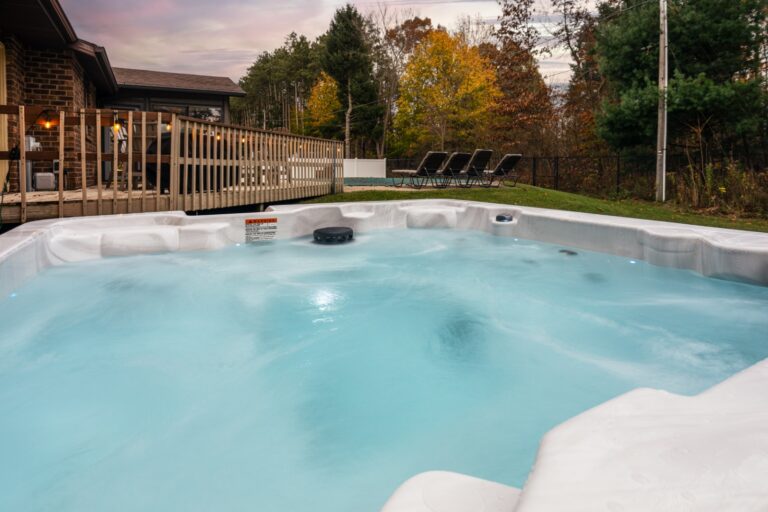 Outdoor hot tub by wooden deck