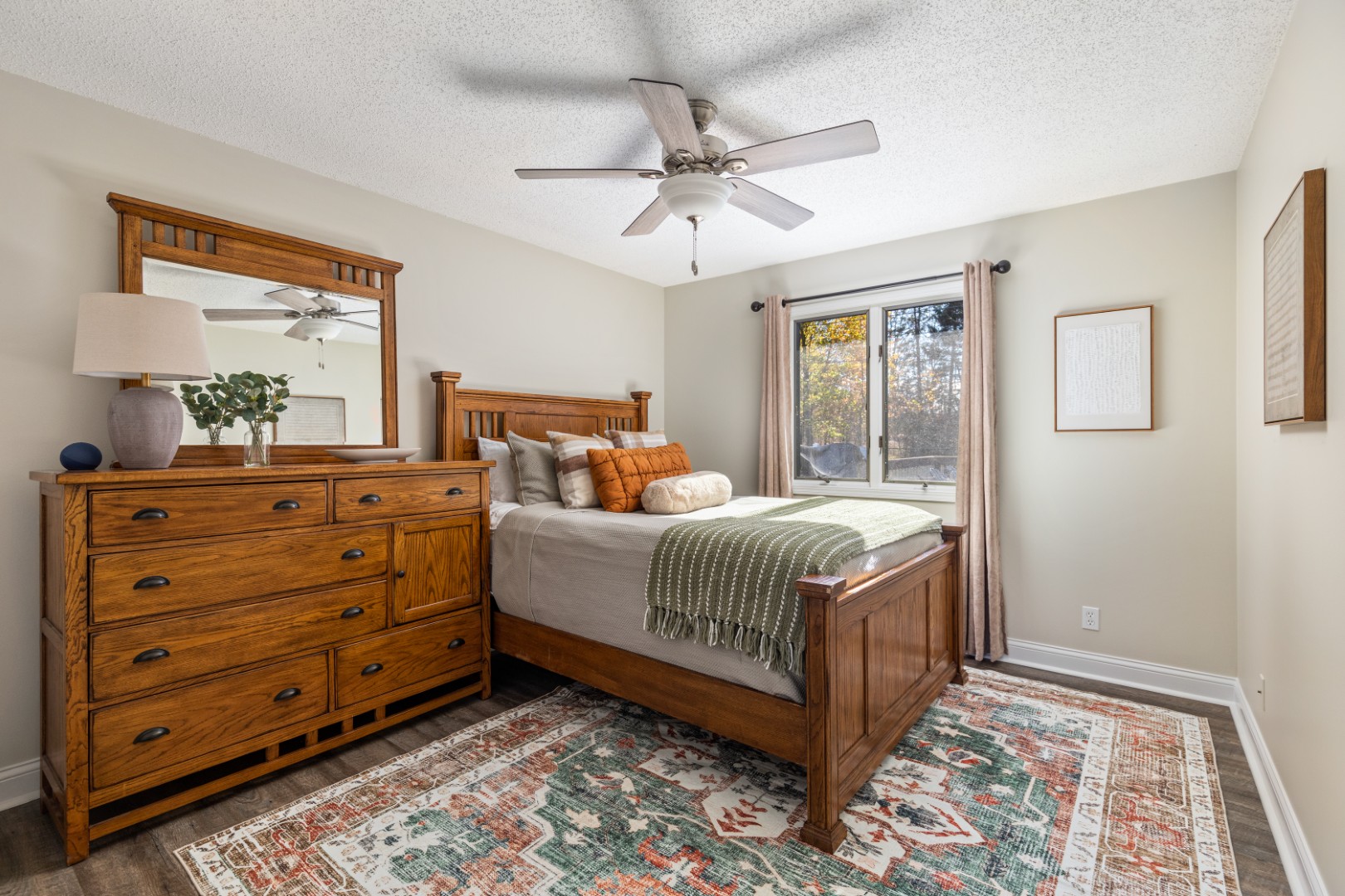 Cozy bedroom with wooden furniture and window view