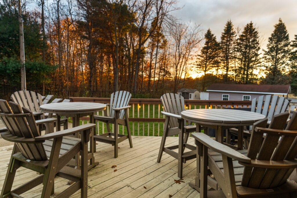Wooden deck with chairs at sunset