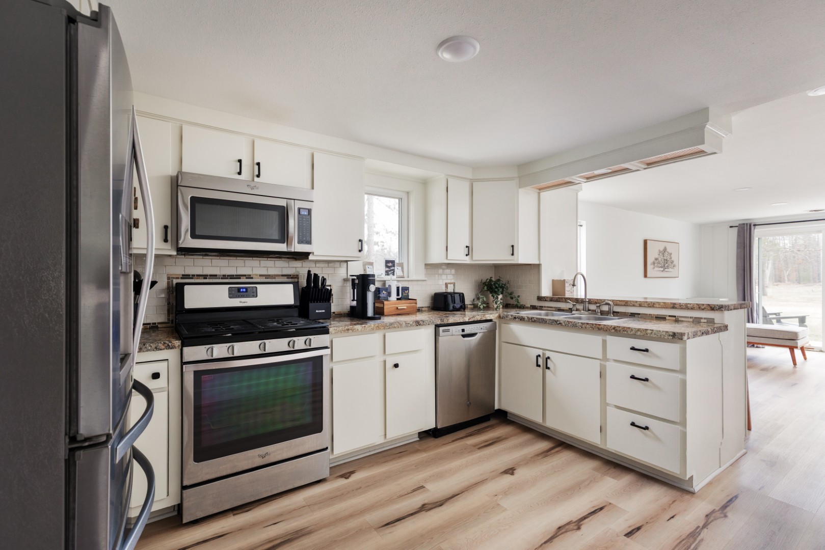 Modern kitchen with stainless steel appliances and cabinets
