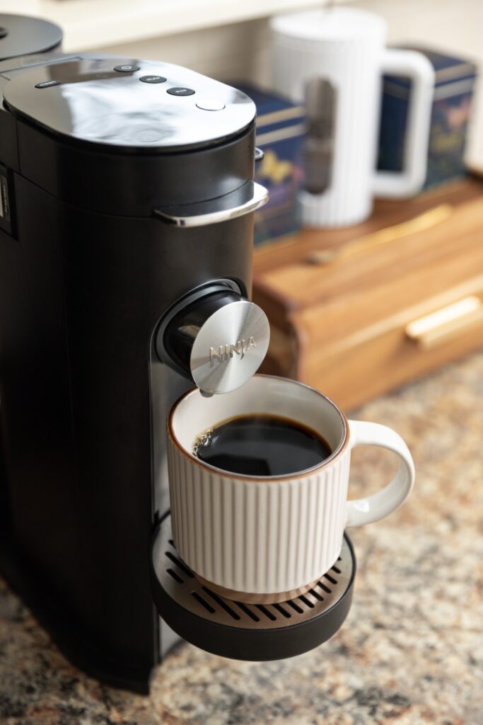 Coffee maker brewing a cup of coffee
