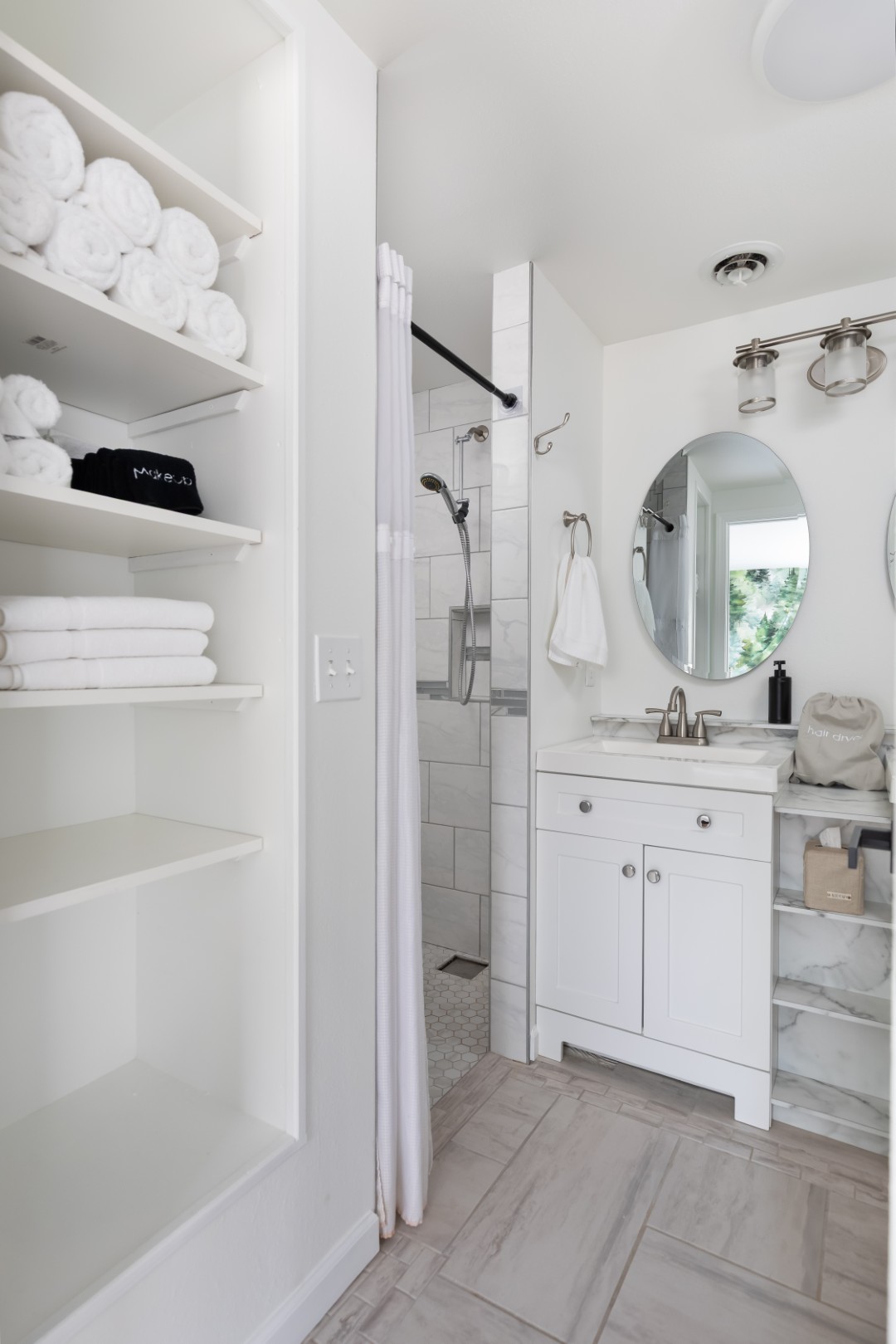 Modern white bathroom with shower and vanity