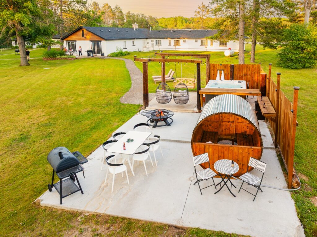 Outdoor patio with sauna and seating area