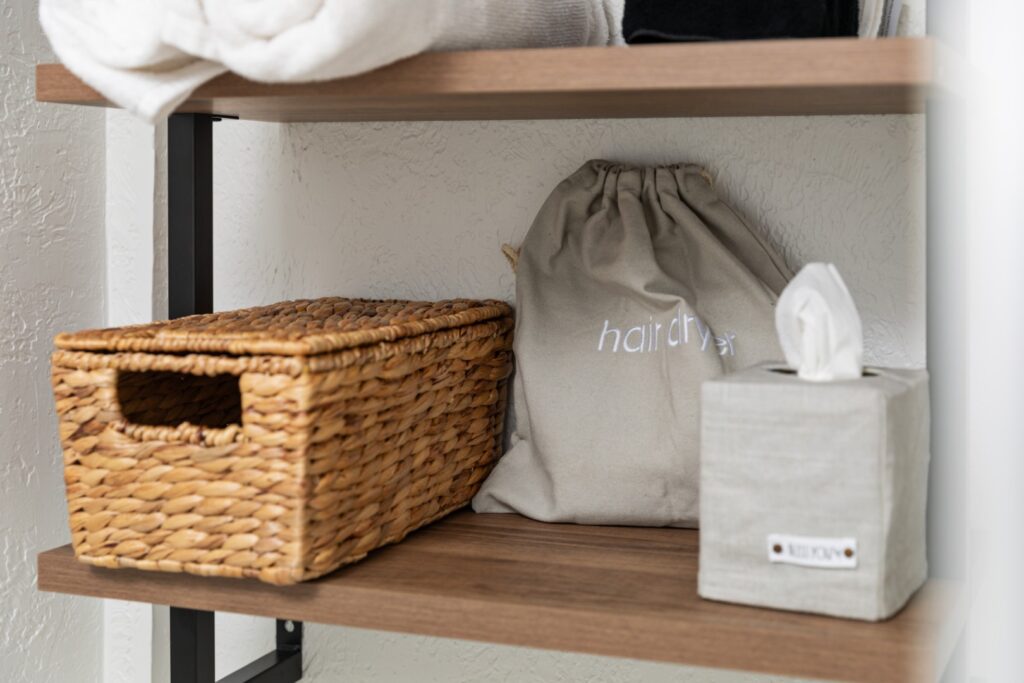 Bathroom shelf with basket and tissue box