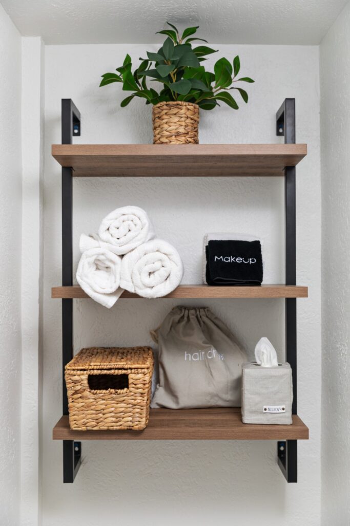 Bathroom shelves with towels and decorative items