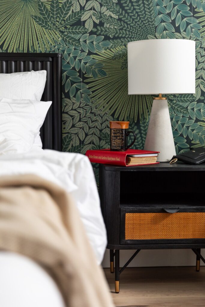 Modern bedroom nightstand with lamp and books