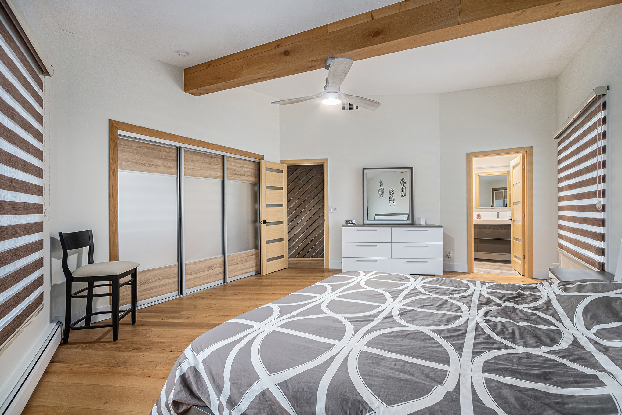 Modern bedroom with wooden accents and dresser