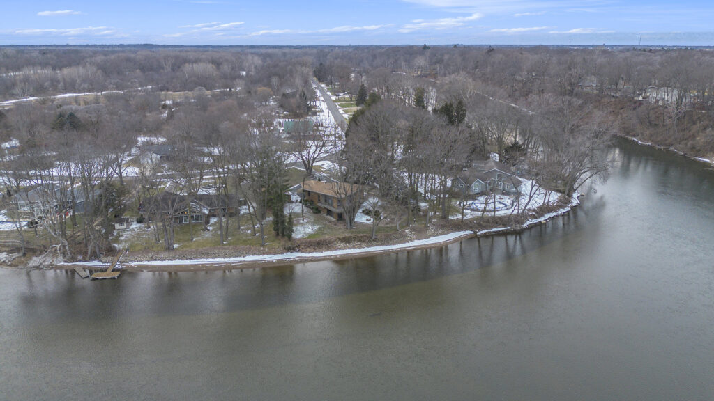 Aerial view of riverside homes in winter
