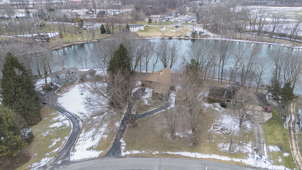 Aerial view of riverside houses in winter