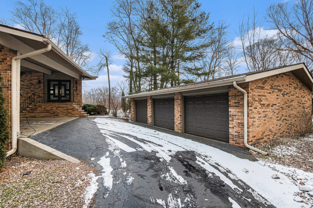 Brick house with three-car garage in winter