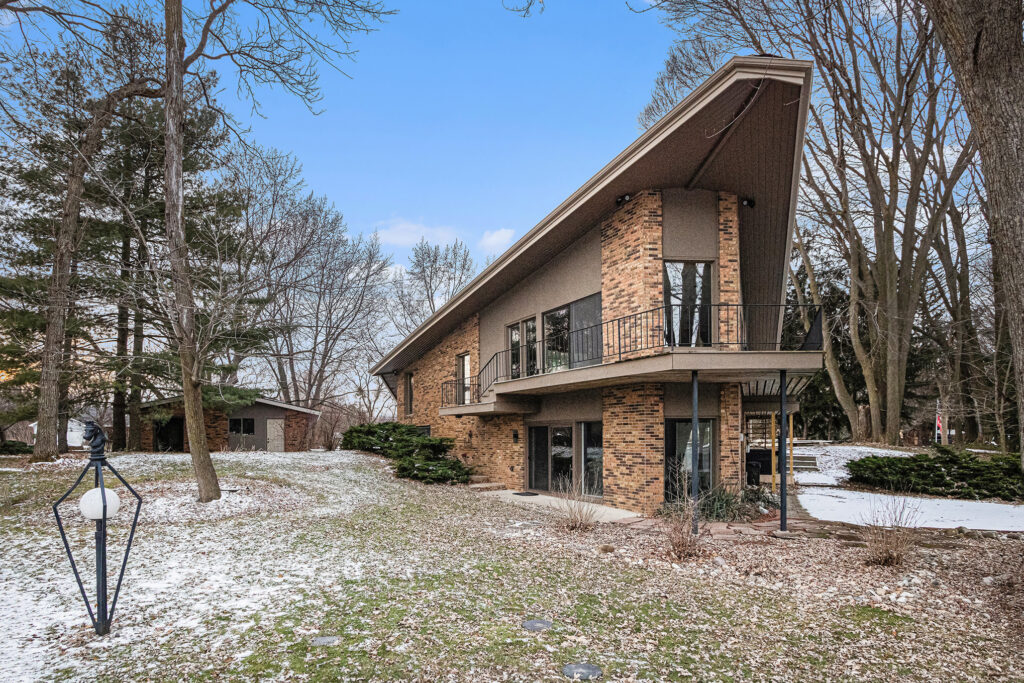 Modern brick house with sloped roof in winter