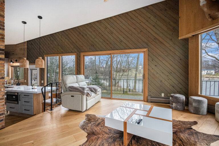 Modern living room with river view and large windows