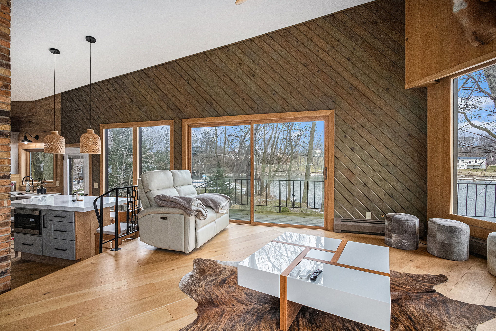 Modern living room with river view and large windows