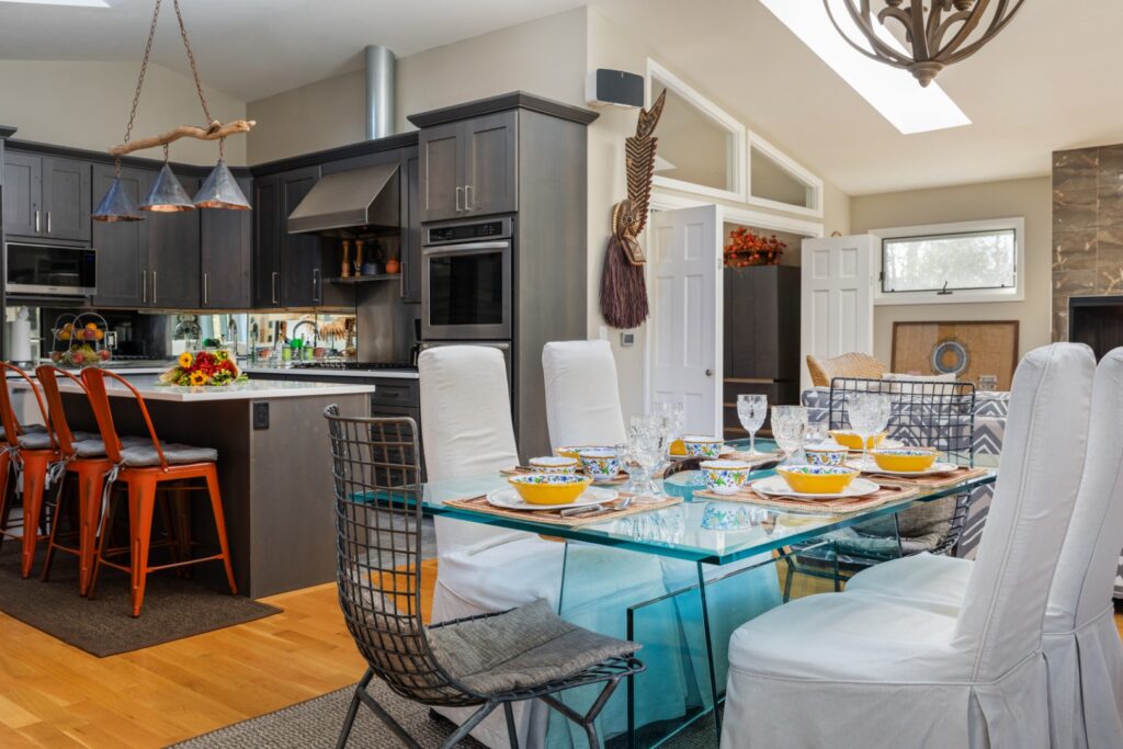 Modern kitchen and dining area with glass table
