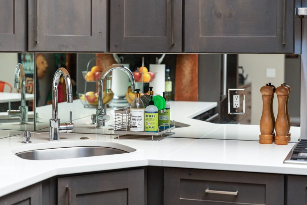 Modern kitchen sink with soap and pepper mills