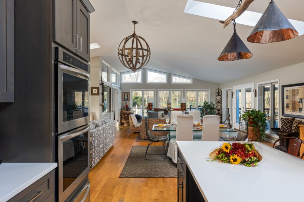 Modern open kitchen and dining area with sunlight