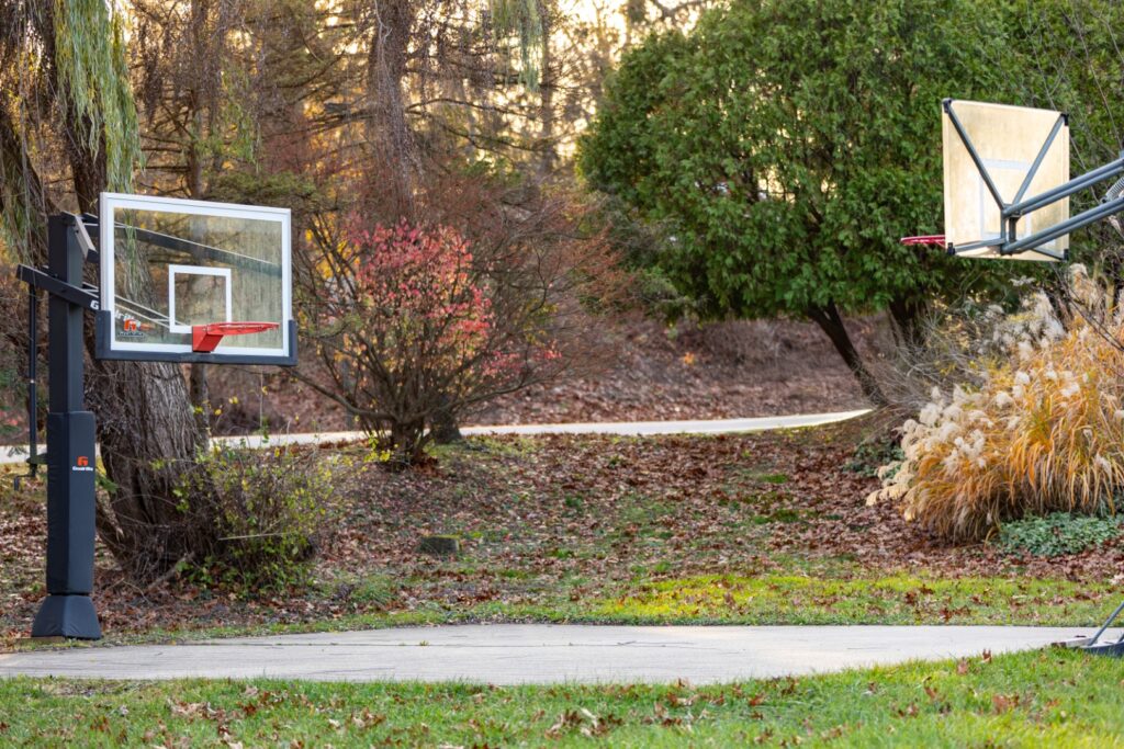 Outdoor basketball hoops on a driveway in autumn