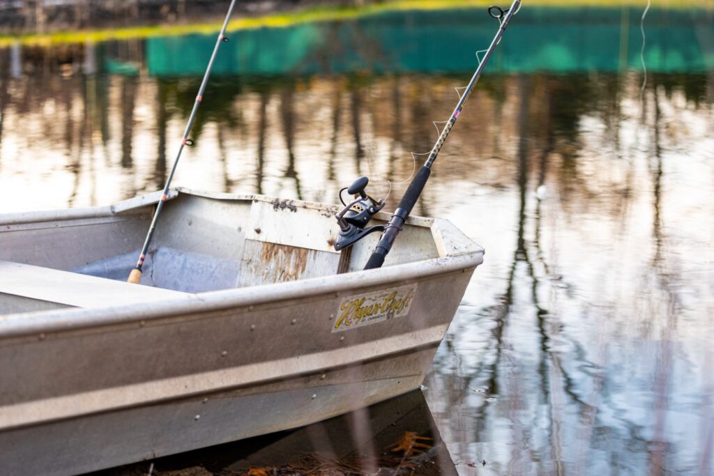 Fishing rods resting in a small aluminum boat