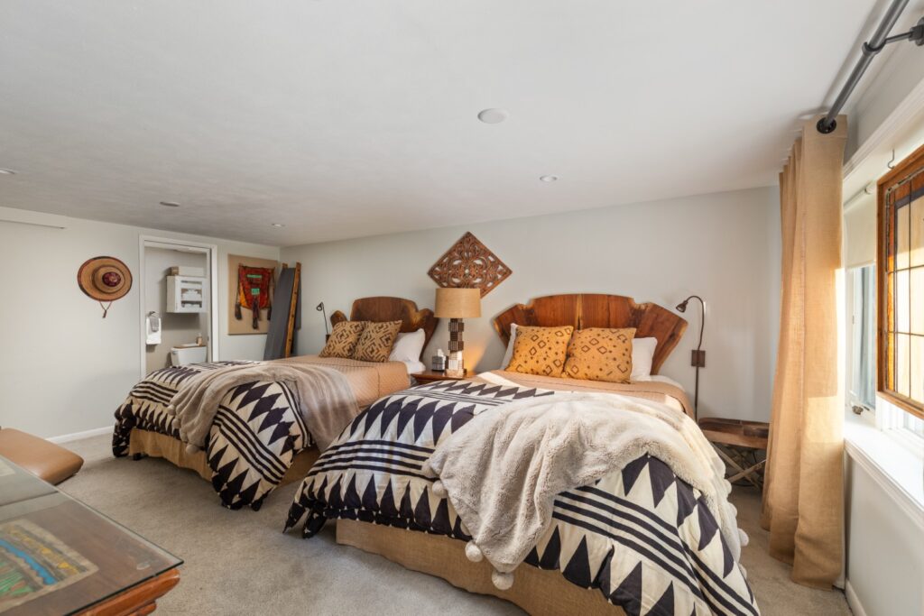 Cozy bedroom with two rustic double beds