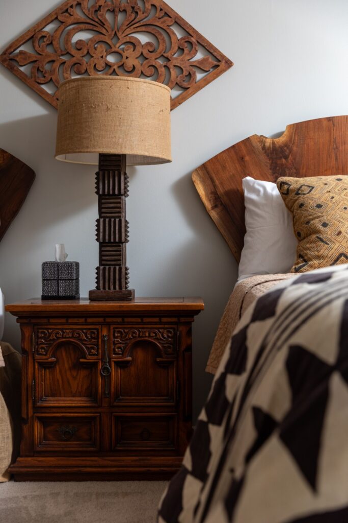 Rustic bedroom nightstand with lamp and decor