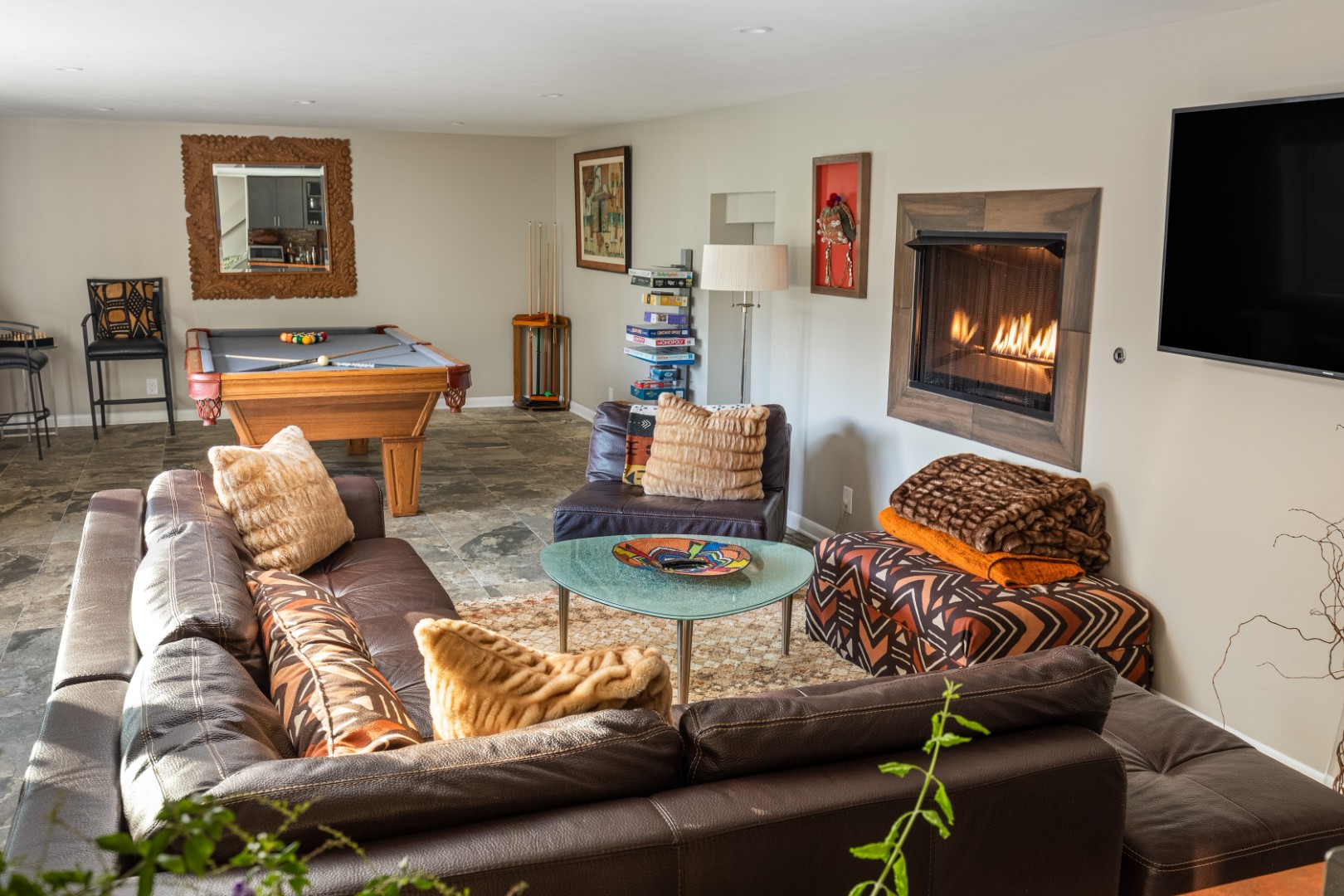 Cozy living room with fireplace and pool table