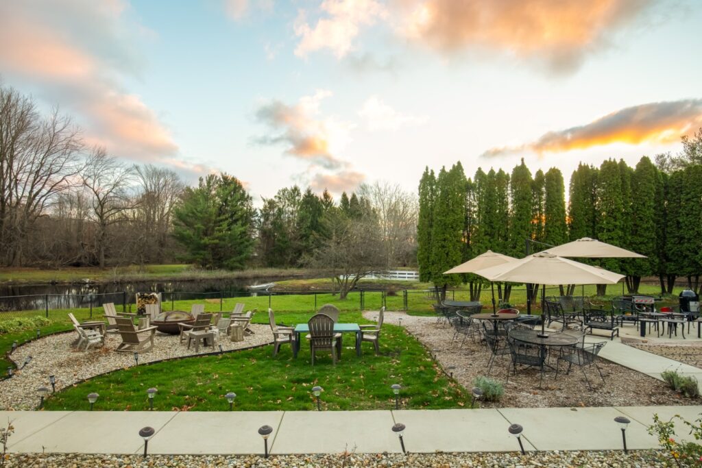 Outdoor patio with seating and fire pit area