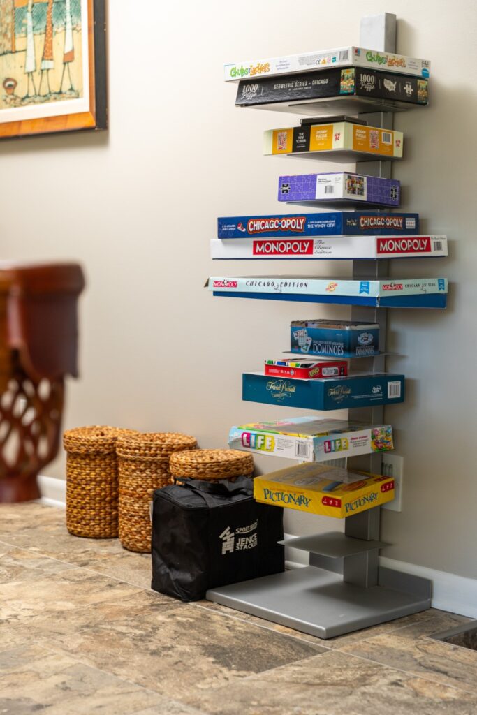 Stack of board games on modern shelf
