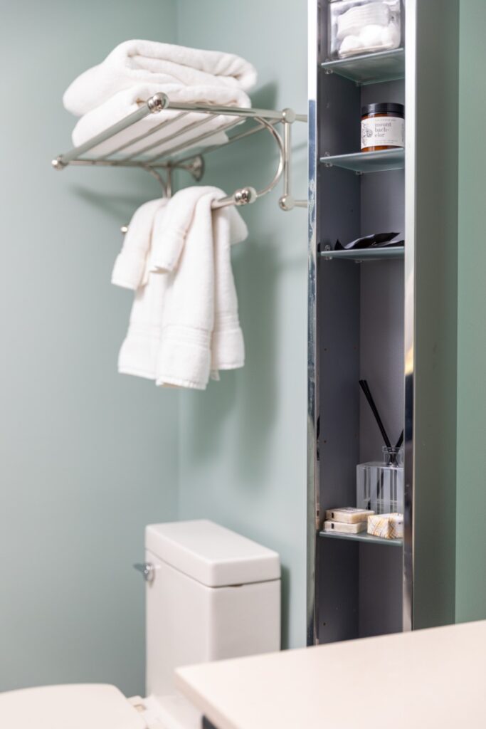 Modern bathroom with towels and storage shelves
