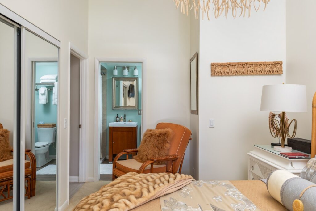 Cozy bedroom with bathroom and soft lighting