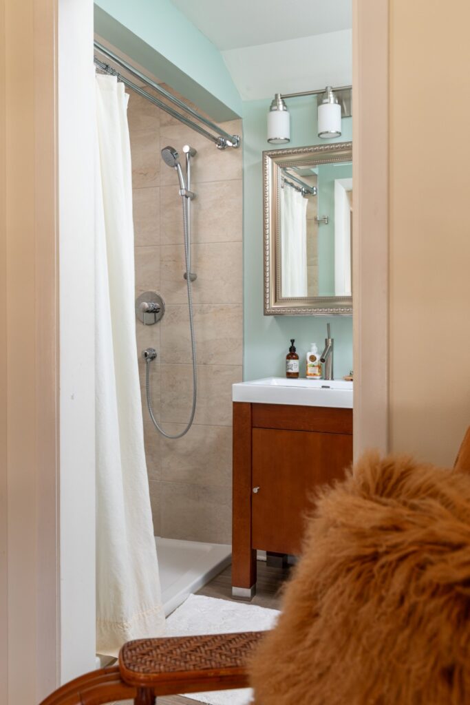 Modern bathroom with shower and wooden vanity