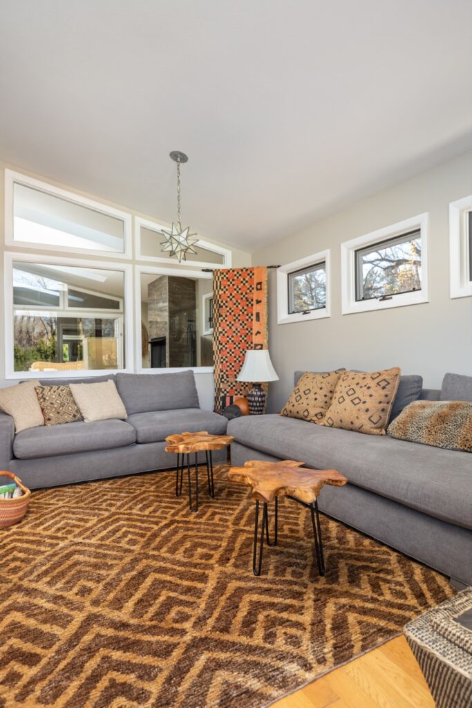 Modern living room with gray sofas and wood tables