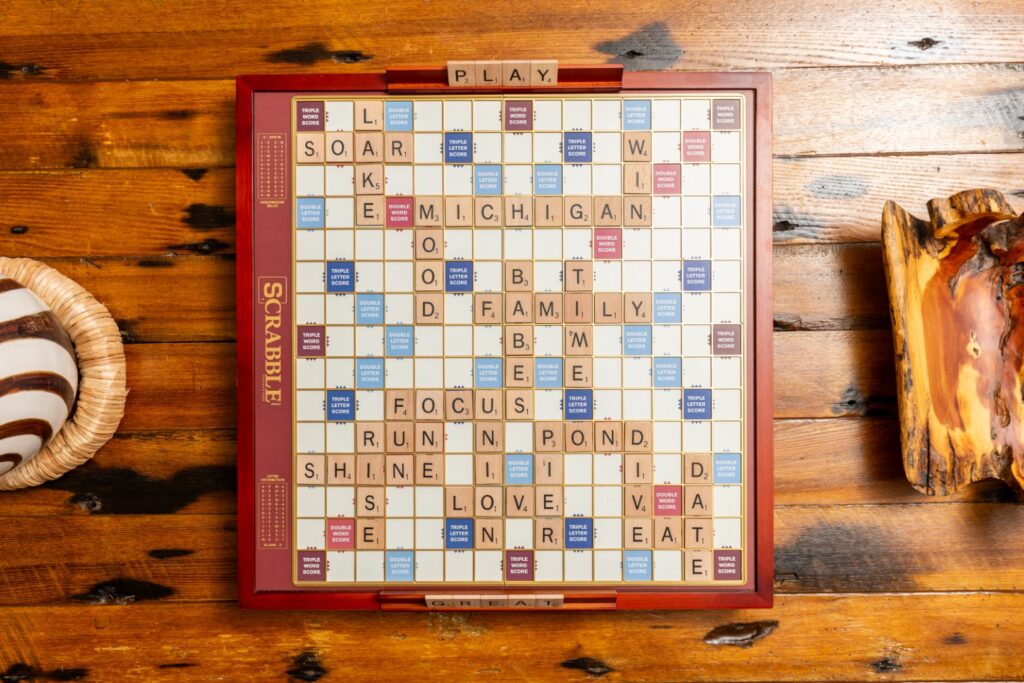 Scrabble board game on wooden table