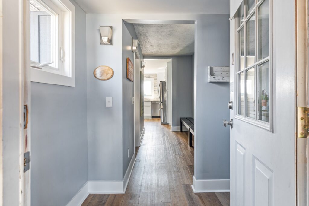 Bright hallway leading to modern kitchen