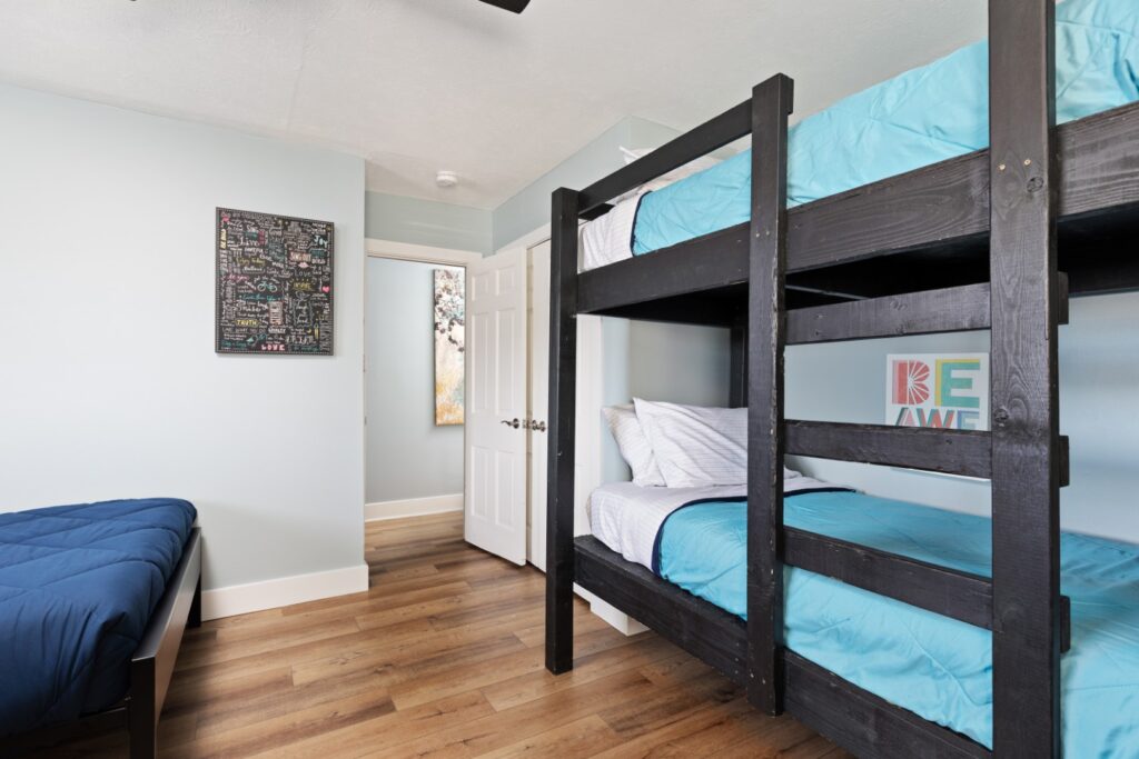 Bedroom with bunk beds and blue bedding