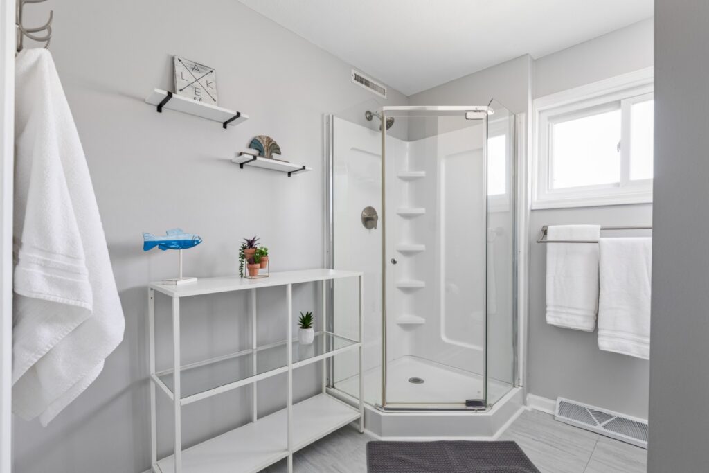 Modern bathroom with glass shower and white decor