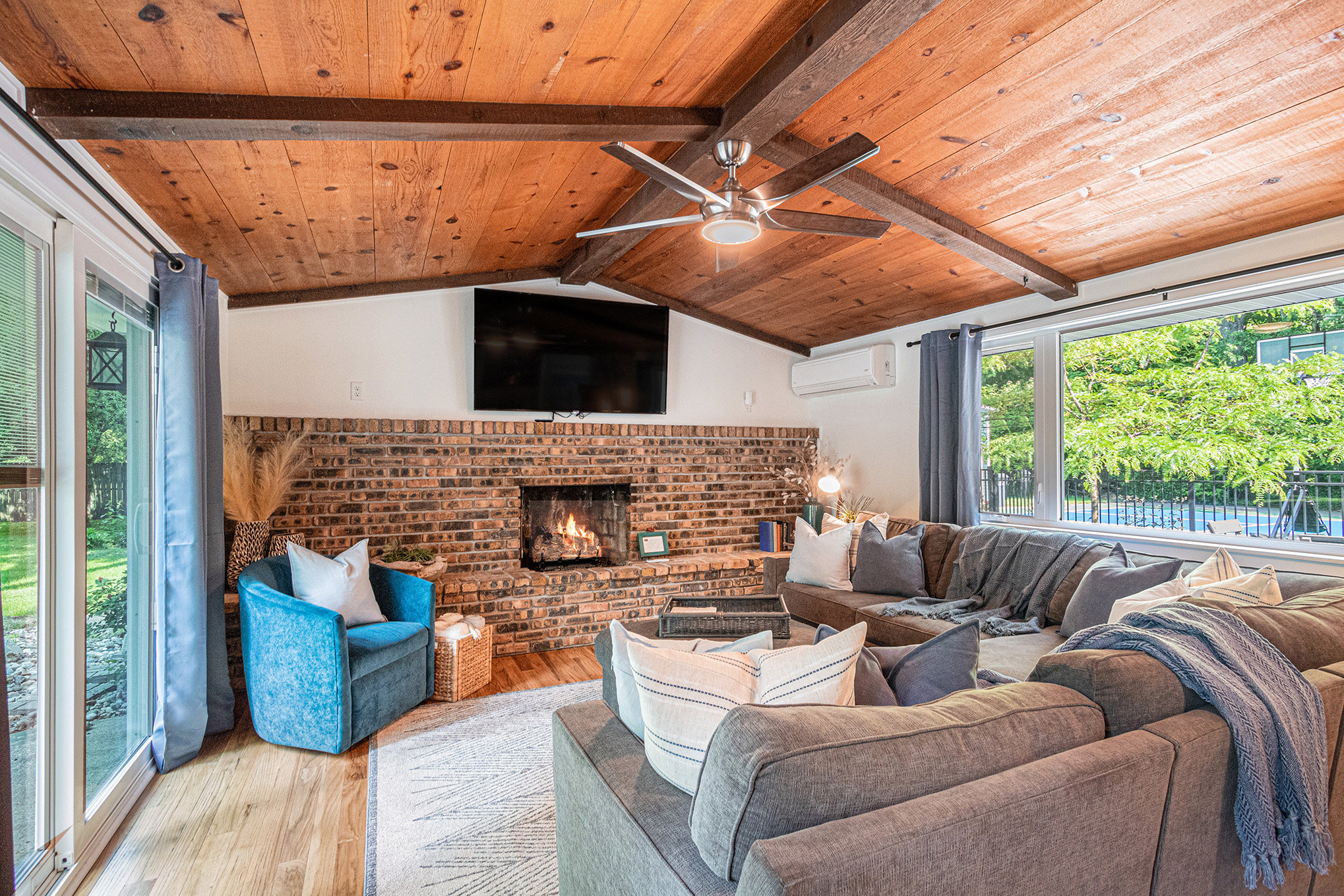 Cozy living room with fireplace and large windows
