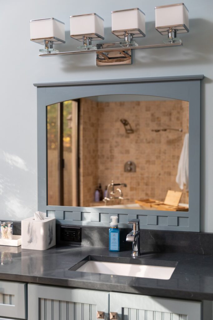 Modern bathroom vanity with mirror and sink.