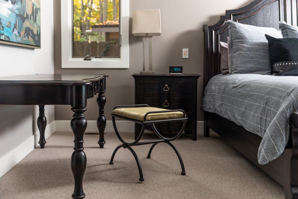 Modern bedroom with dark wood furniture and decor