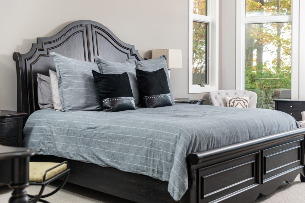 Modern bedroom with dark wood bed frame