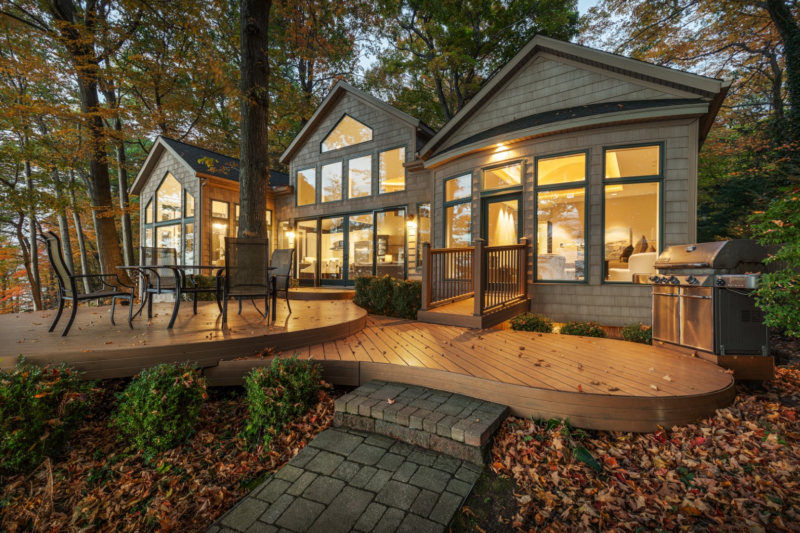 Modern cabin with deck in autumn woods