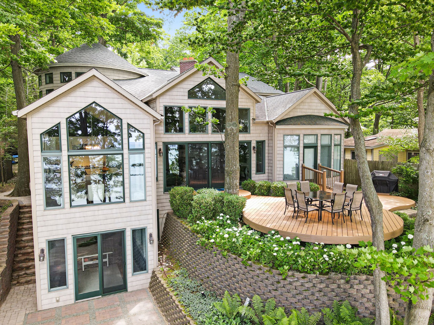 Modern lakeside home with deck and large windows