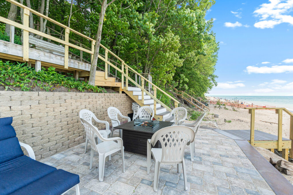 Beachside patio with chairs and fire pit