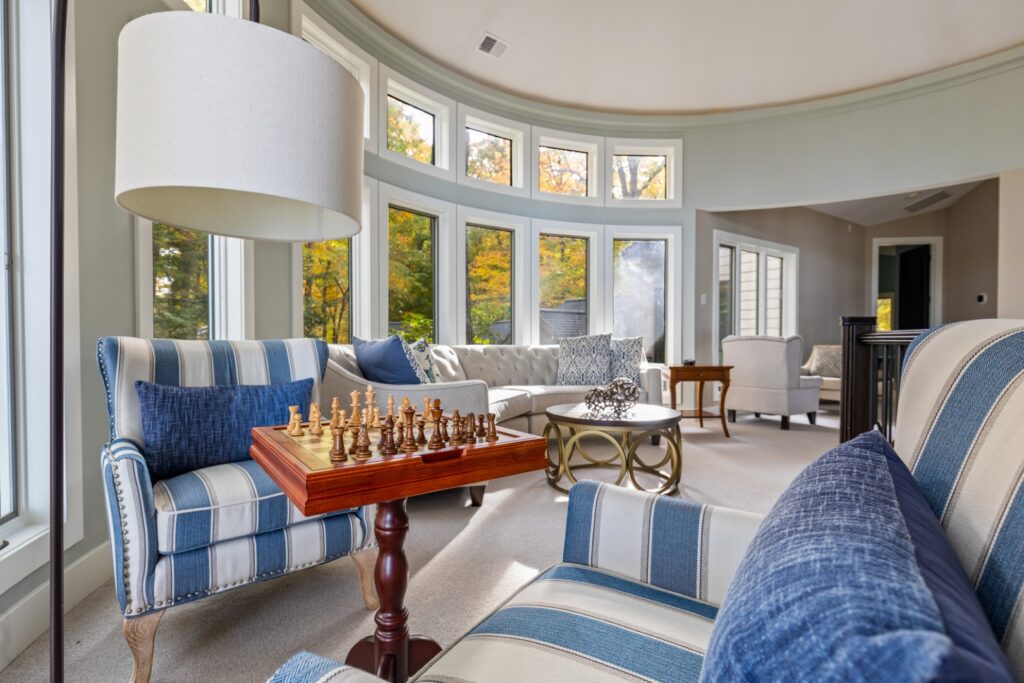 Bright living room with chessboard and large windows