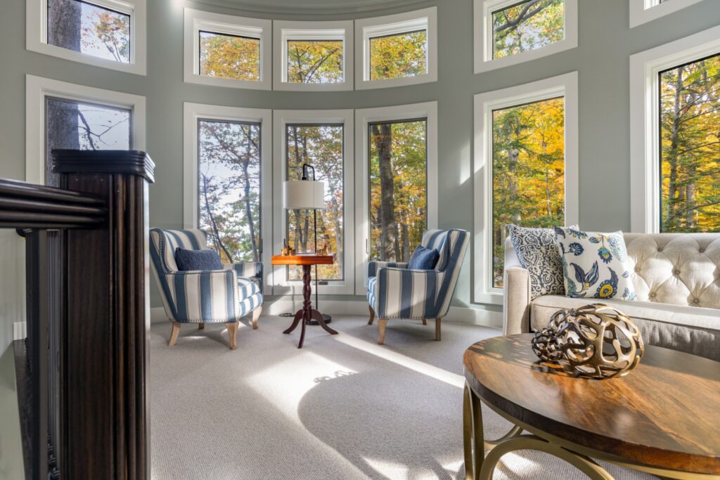 Bright living room with large windows and chairs