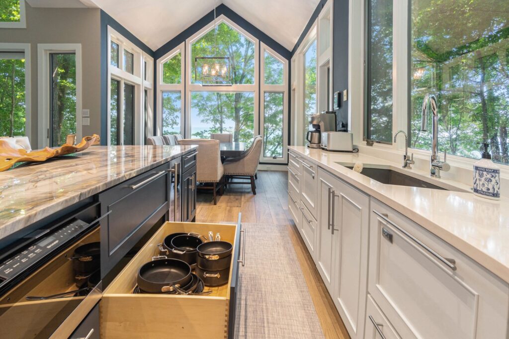 Modern kitchen with marble island and large windows
