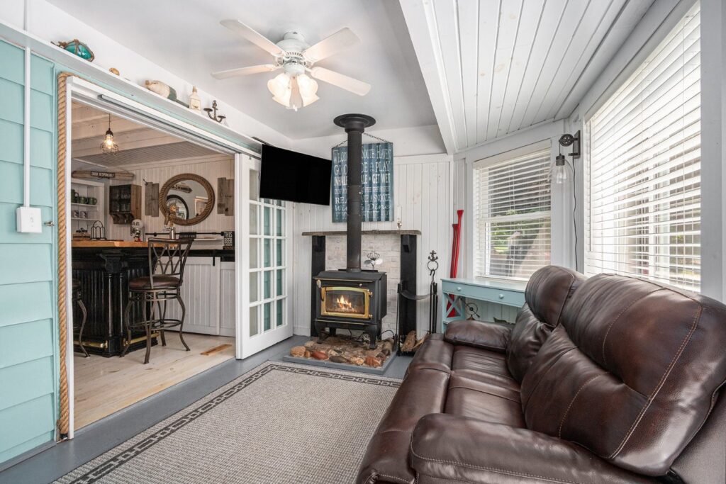 Cozy living room with fireplace and leather sofa