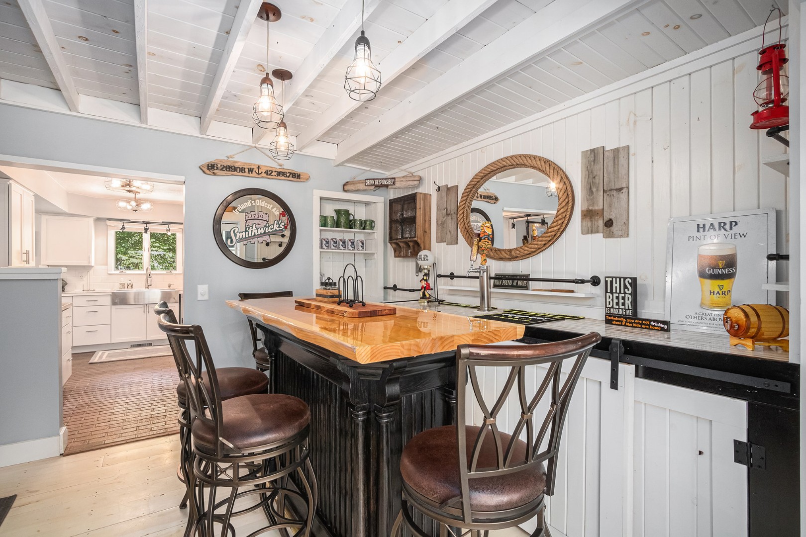 Cozy home bar with wooden counter and stools