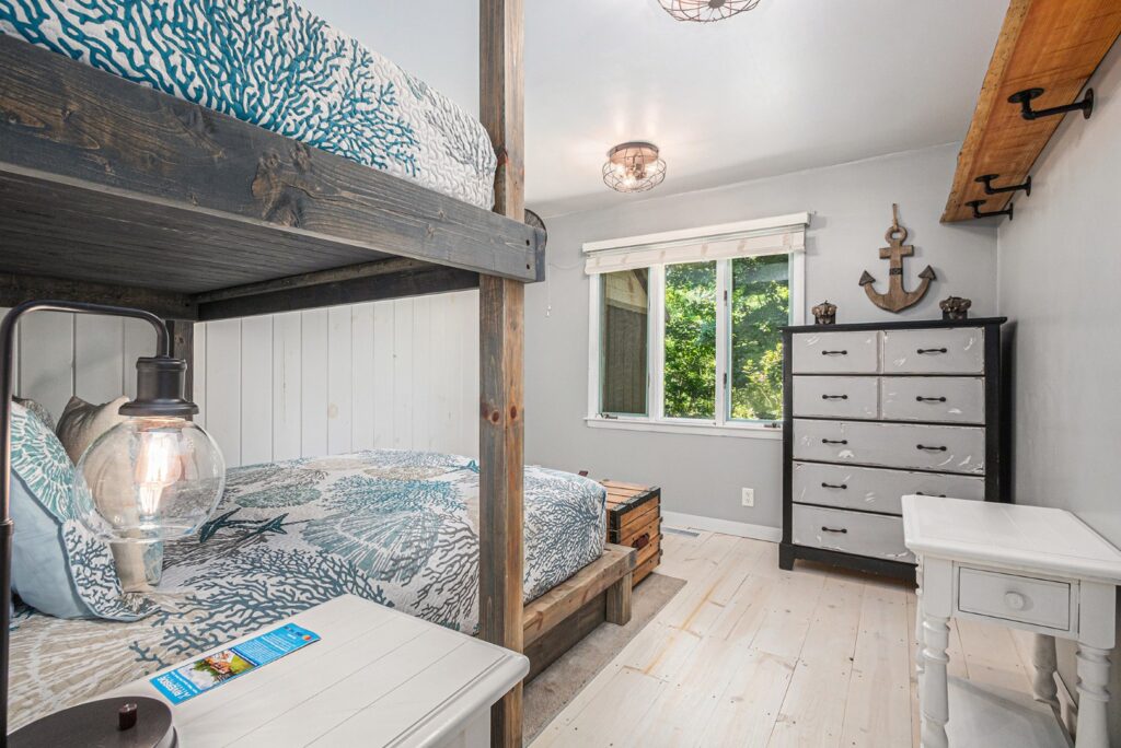 Cozy bedroom with bunk beds and ocean decor